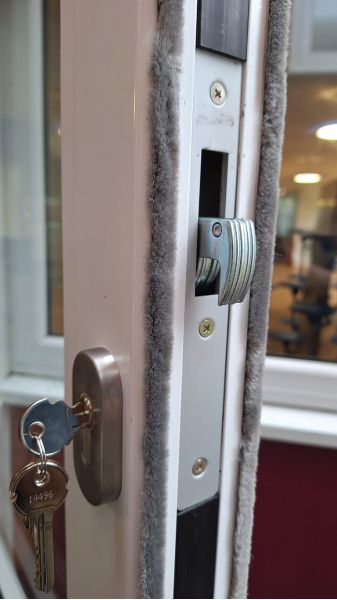 Wooden doors replaced with aluminium euro cylinder and hook locking door